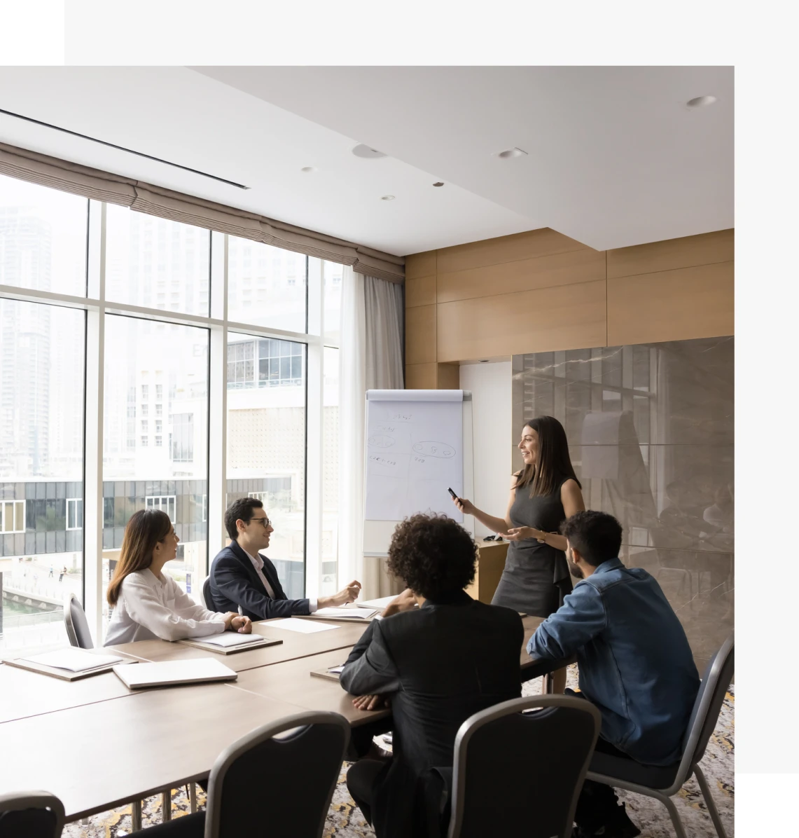 Colleagues discussing at office meeting table
