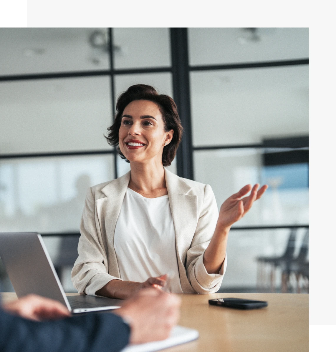 Professional woman speaking at a meeting